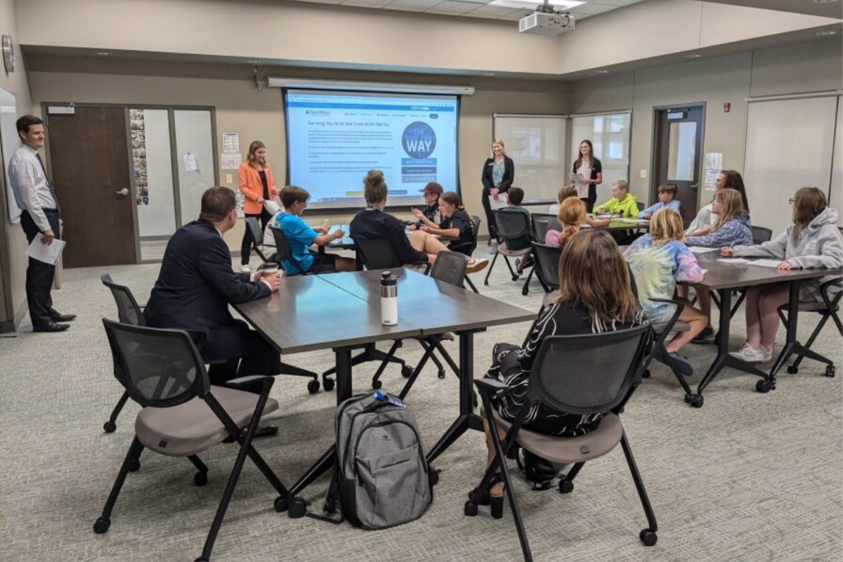 Trust Point Volunteers Educating Students on Investing
