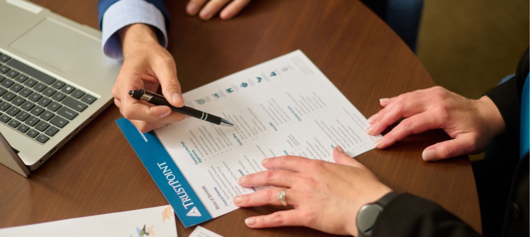 Trust Point team members reviewing the menu of services