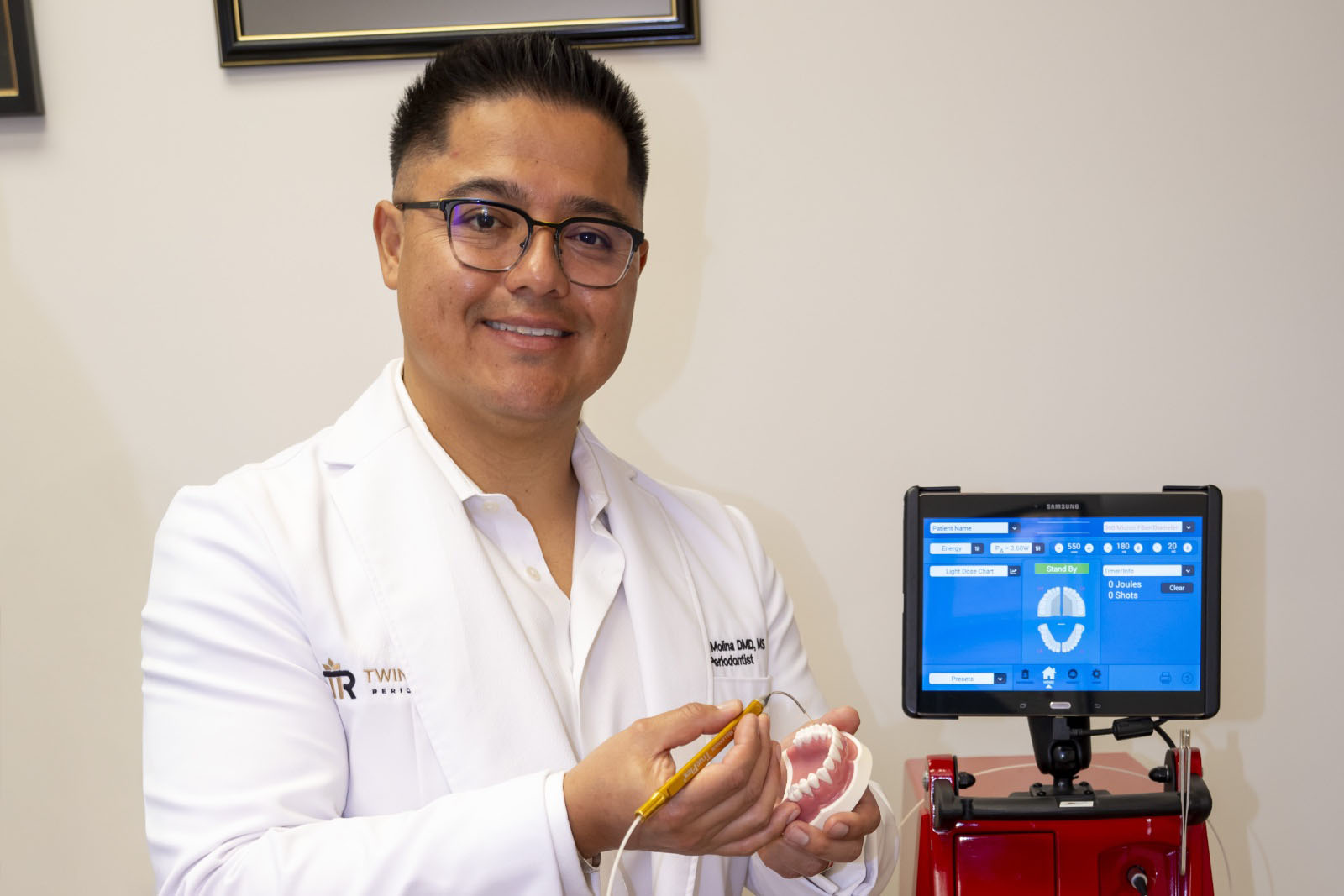 Dr. Molina in front of a Millennium scanner