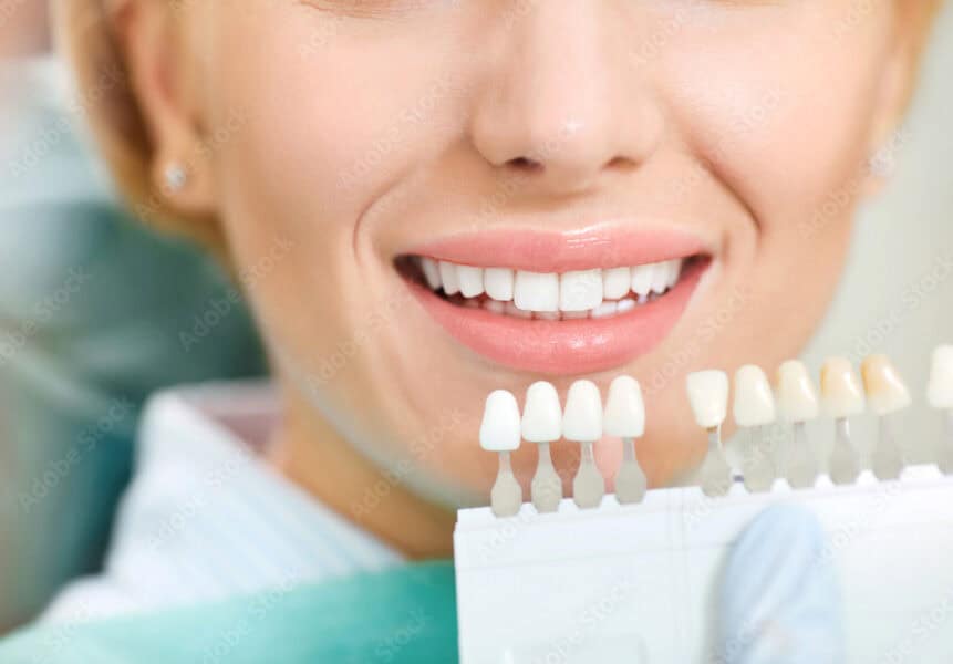 Person holding a document in hand.