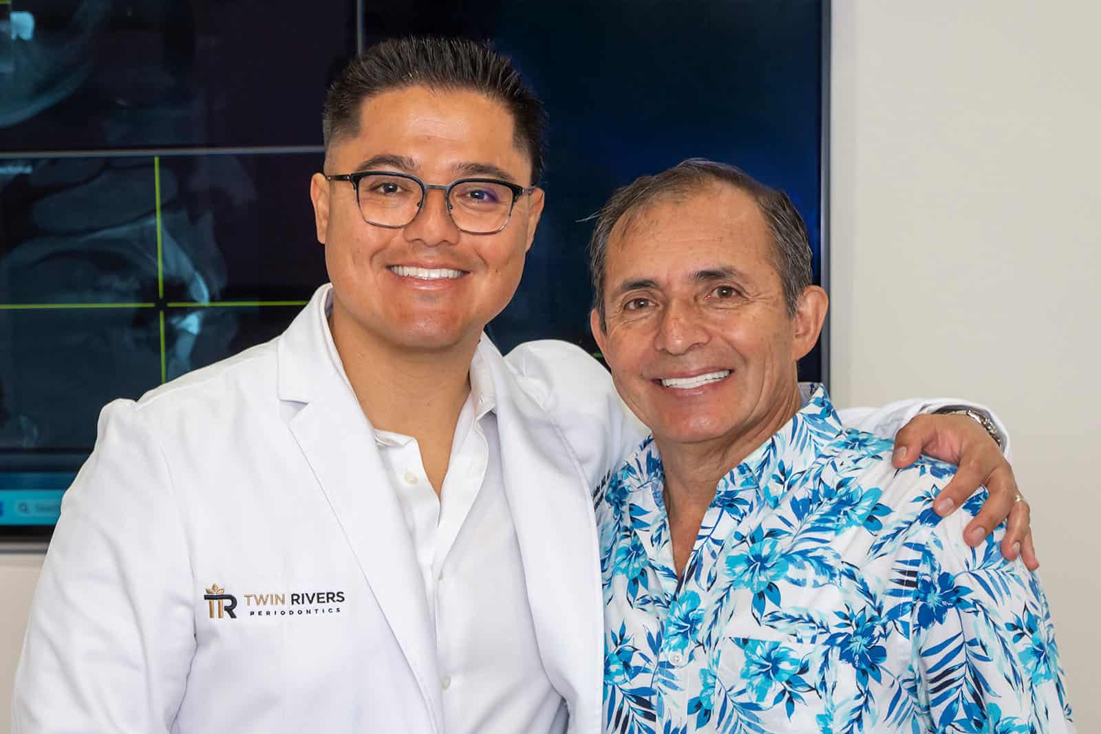 Dr. Molina smiling with a patient after a procedure