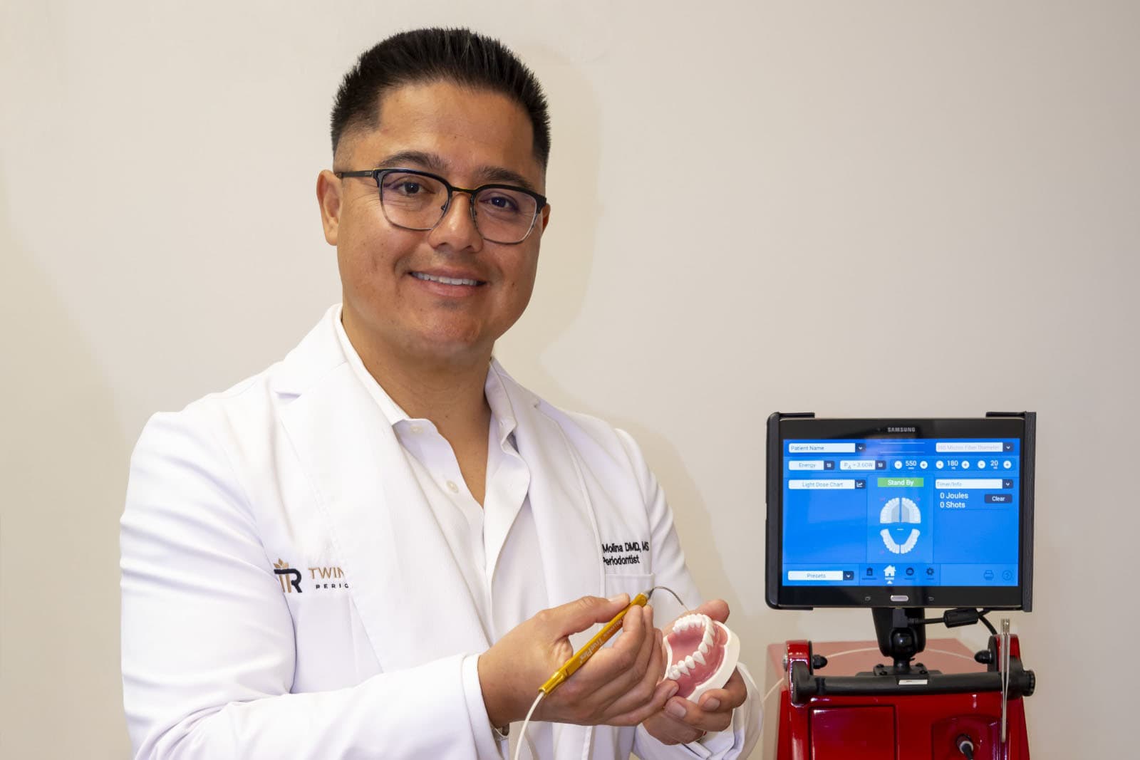 Dr. Molina in front of a Millennium scanner