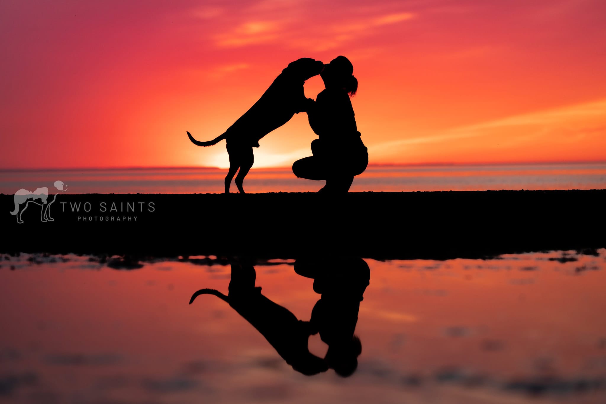 Woman and her dog at Lakeside Beach at sunset