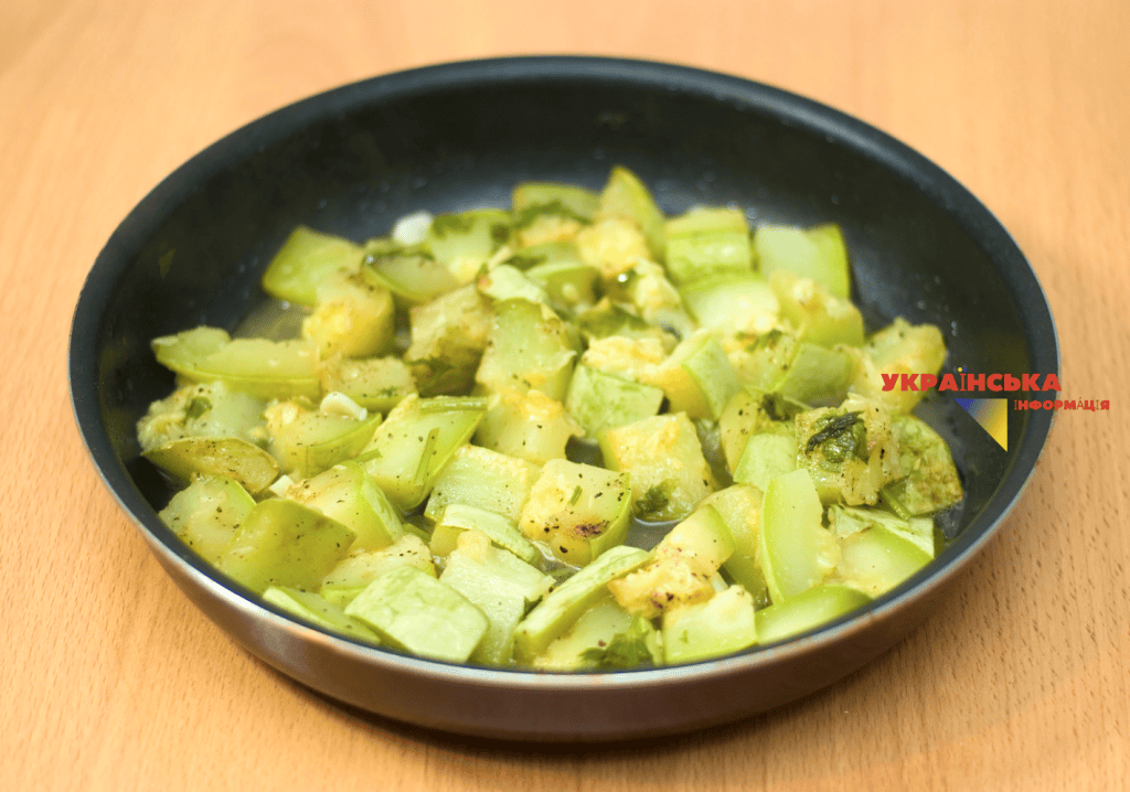 The photo shows the process of preparing breaded zucchini sticks