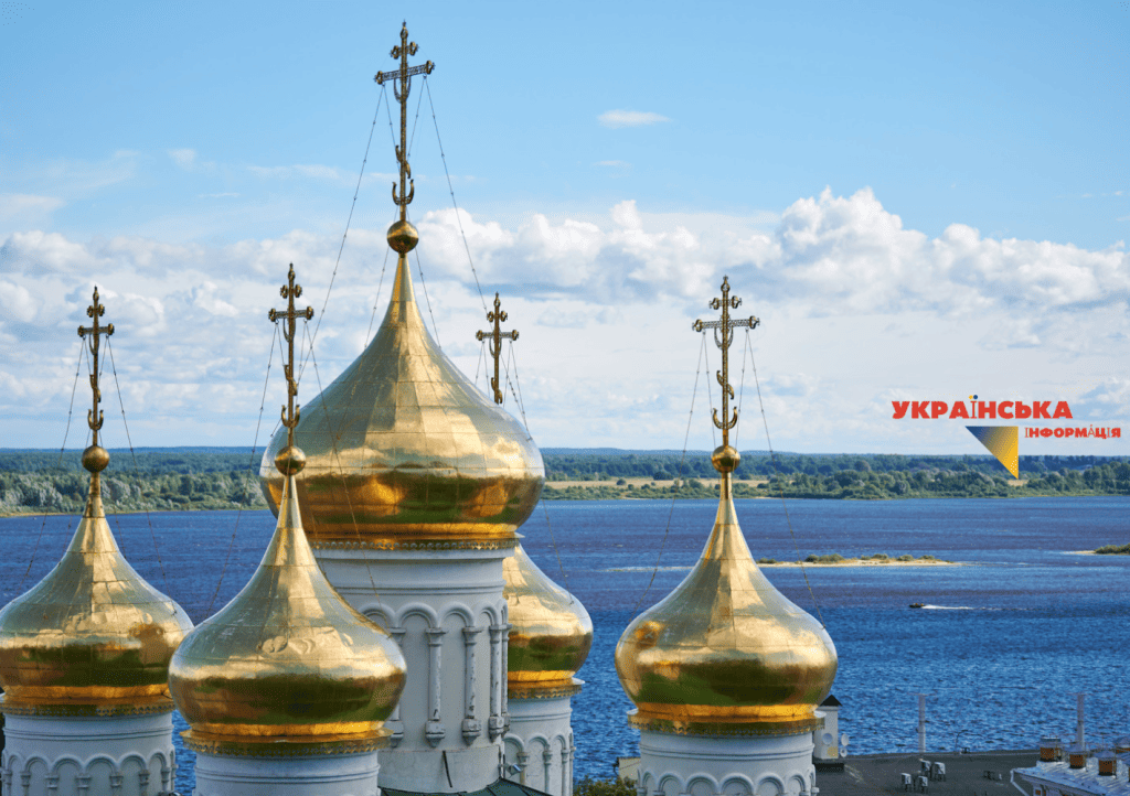 The photo shows an Orthodox Christian church with a cross on its domes.