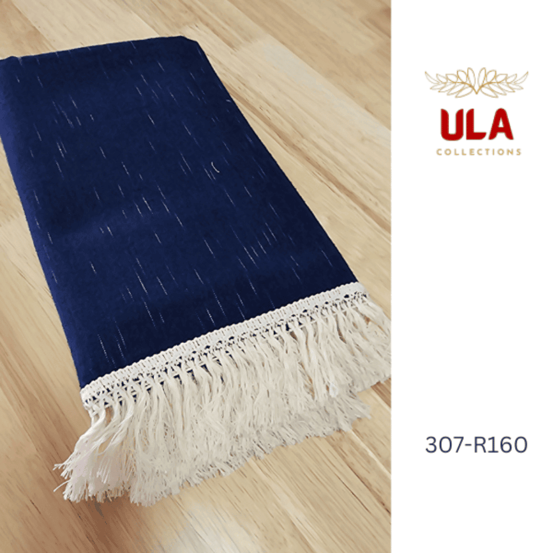 A large navy blue woven throw blanket or textile tapestry featuring a subtle white Ikat pattern of small, dashed lines, suggesting a soft texture.