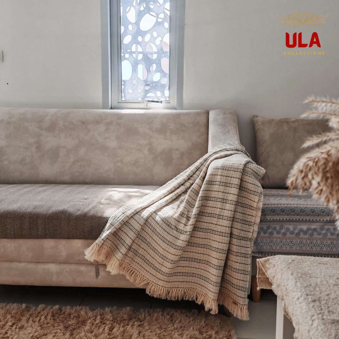 Sage green and cream striped cotton throw blanket with fringe, neutral boho sofa styling and cozy home textiles by ULA Collections.