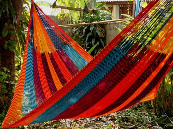 Woven net hammock chair, "Mexico" pattern, featuring vibrant deep blue and bright white stripes with alternating bands of orange, red, and turquoise, reminiscent of Mexican textiles.