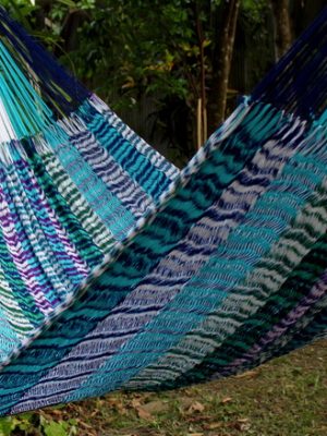 Multi-patterned woven net hammock chair, "Wave" pattern, with blue, white, teal, green, and purple colors in a distinct wave-like pattern at the bottom, conveying a water theme.