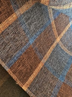 Rustic **plaid woven upholstery fabric** in brown, blue, and gold tones