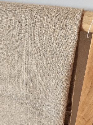 Natural **light beige linen-look** or **hemp-look upholstery fabric** with visible texture