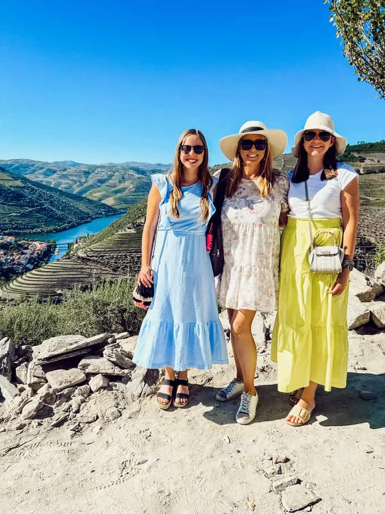 Three women smiling in the Duoro Valley in Portugal
