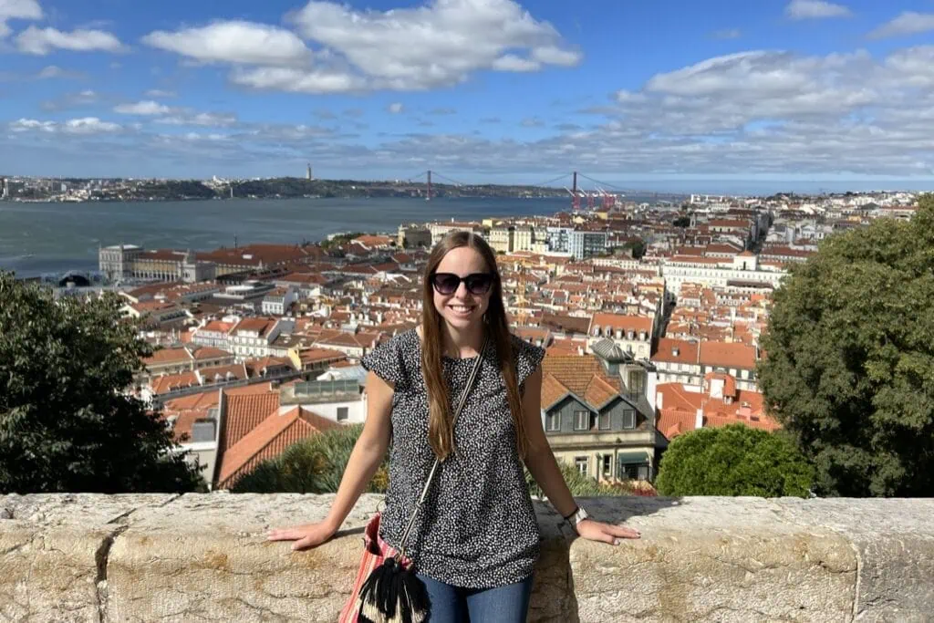 View of Lisbon from Castelo de São Jorge with a smiling woman