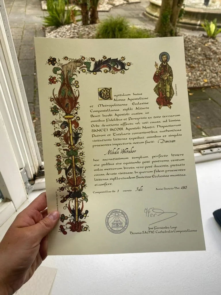 A Compostela certificate from finishing the Camino de Santiago.