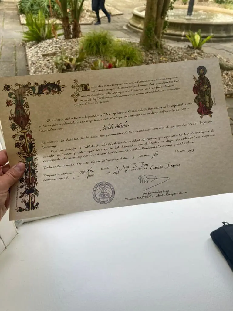 A Camino certificate of distance that includes the route taken and distance traveled.