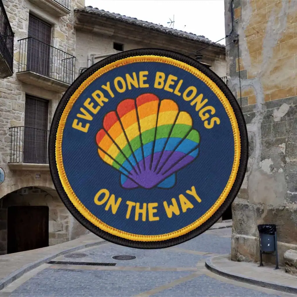Blue patch with a rainbow scallop shell that says "Everyone Belongs On the Way"