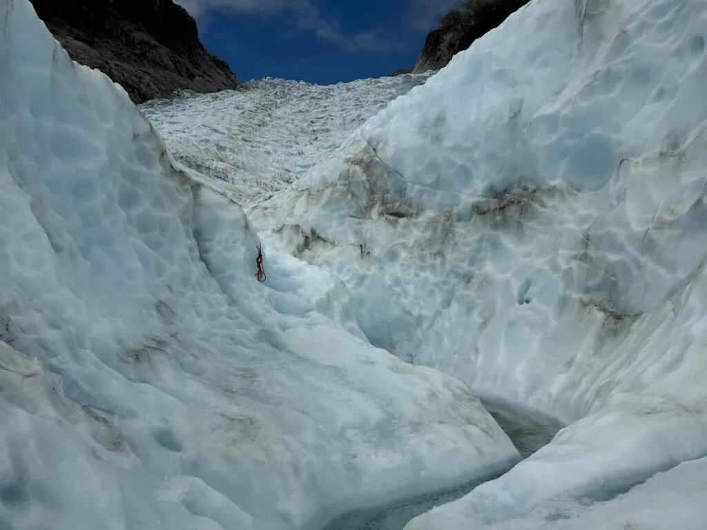 Meltwater cutting through the ice on Fox Glacier.