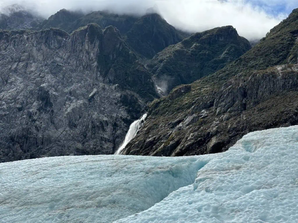 View over Fox Glacier of Victoria Falls in the distance.