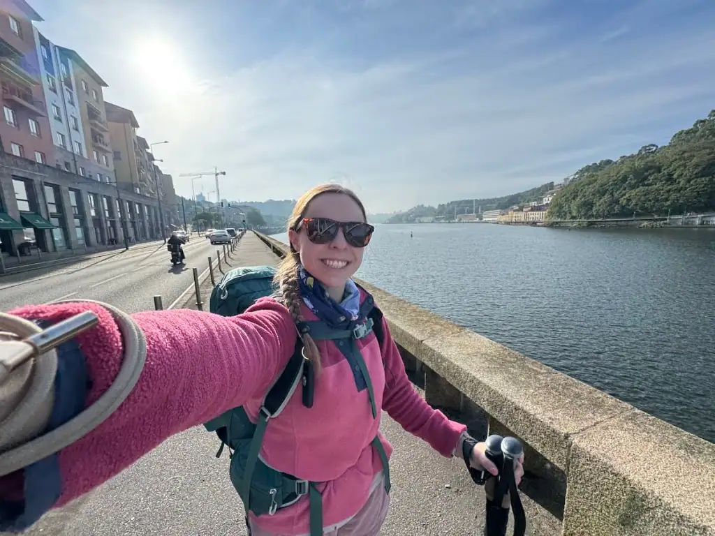 Mikala smiling in a selfie along the Douro River leaving Porto as she starts her 12 day Portuguese Camino route stages.