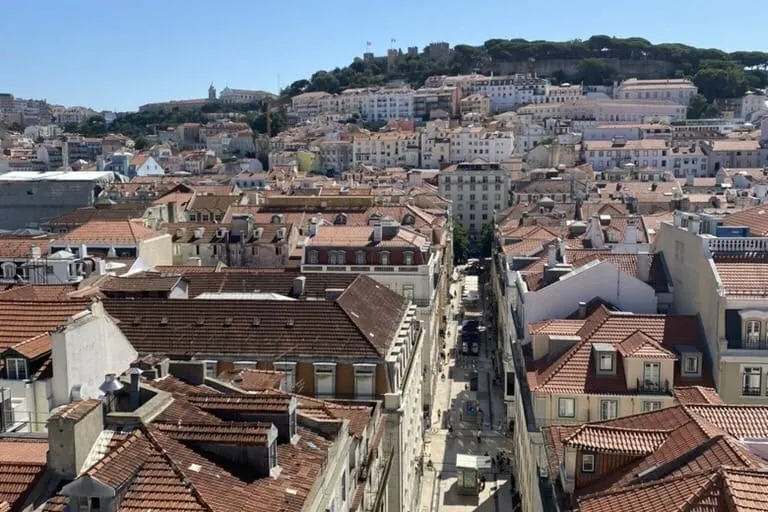 View of Lisbon, Portugal from above showing bright orange rooftops of all the buildings