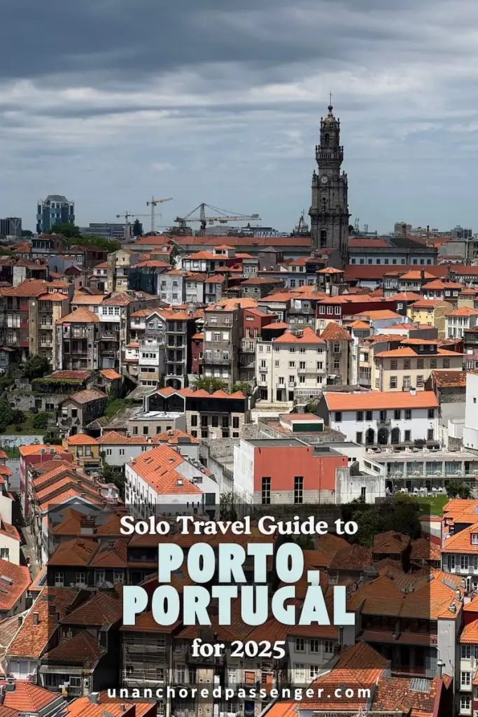 Photo from above of orange roofed buildings in Porto and a tower in the difference with text that says, "Solo Travel Guide to Porto, Portugal for 2025"