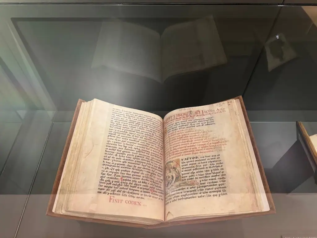 Copy of the Codex Calixtinus, a thick book with faded old pages and text in black and red.