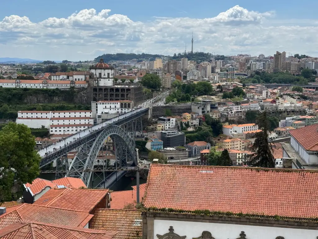 View from the cathedral tower of the Dom Luís I Bridge and buildings built up in Gaia across the river in Porto, Portugal.