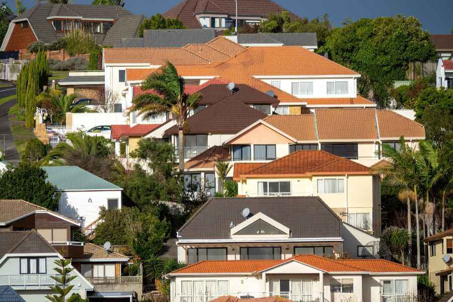 Australian suburban homes representing different private rental rules across states.