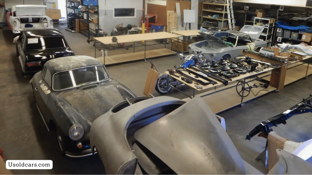 Classic car being inspected for rust and engine damage before starting restoration