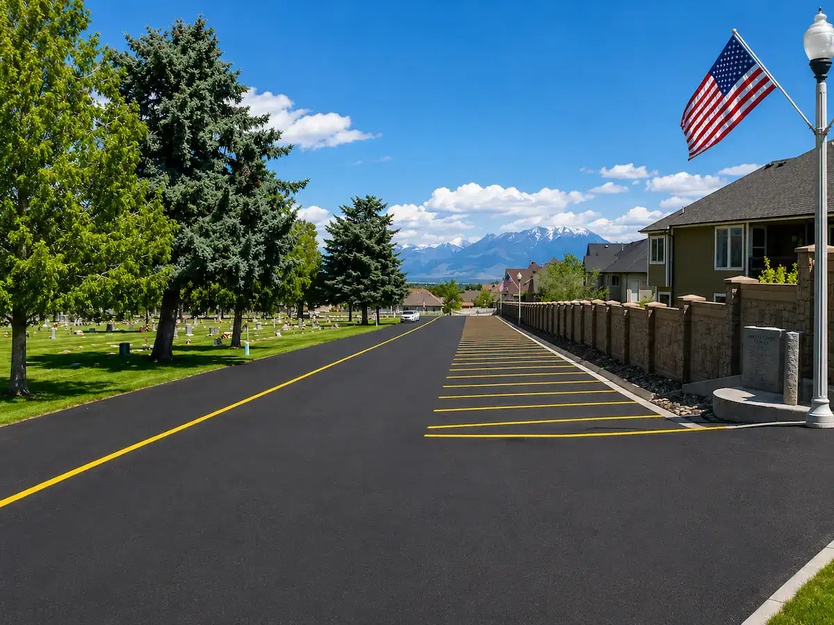 Fresh road striping and asphalt paving near cemetery property in Utah