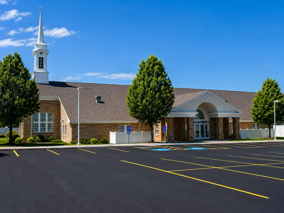Church parking lot striping in Utah with fresh asphalt and ADA spaces