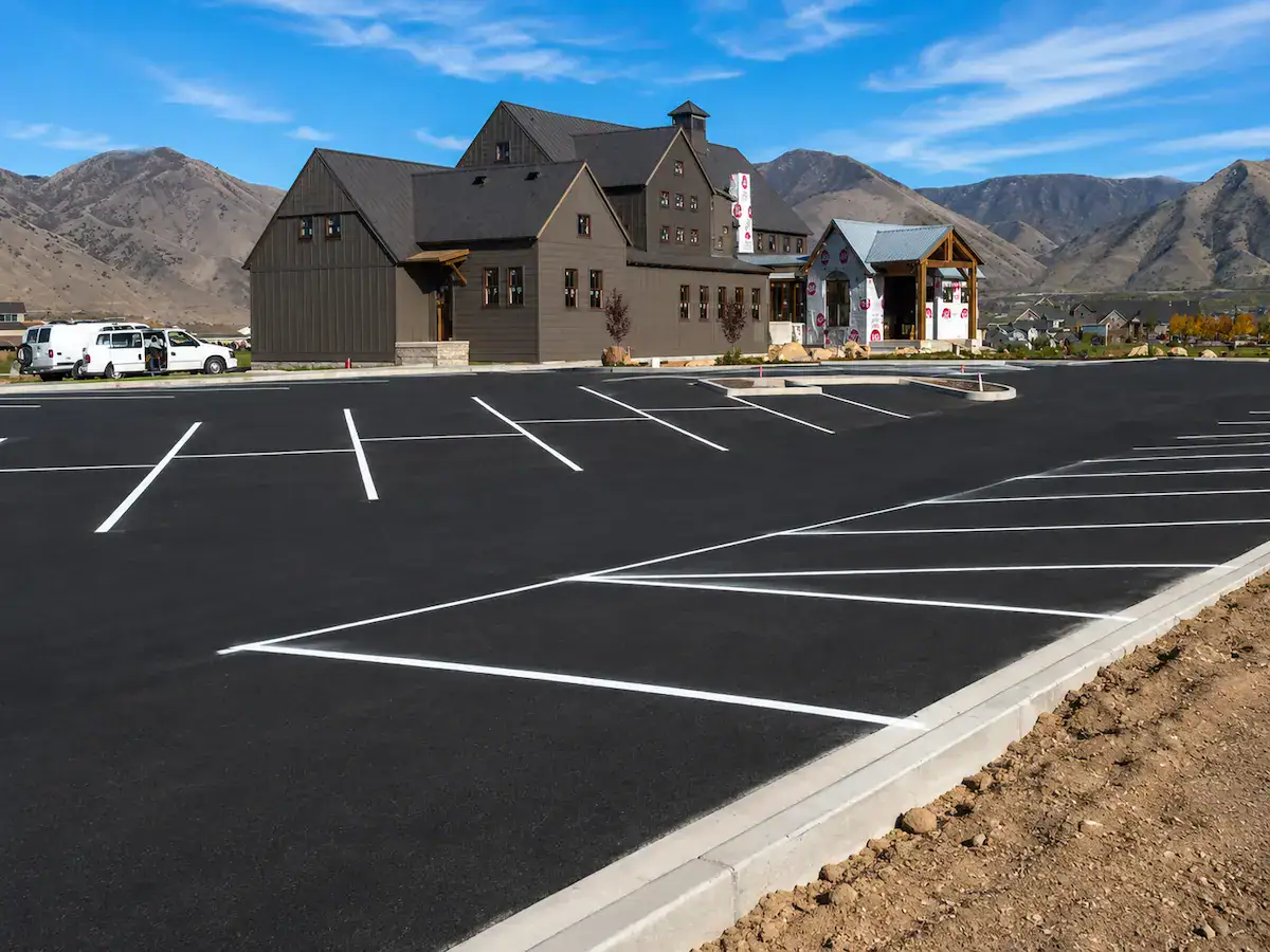 Commercial parking lot striping in Utah with mountain backdrop