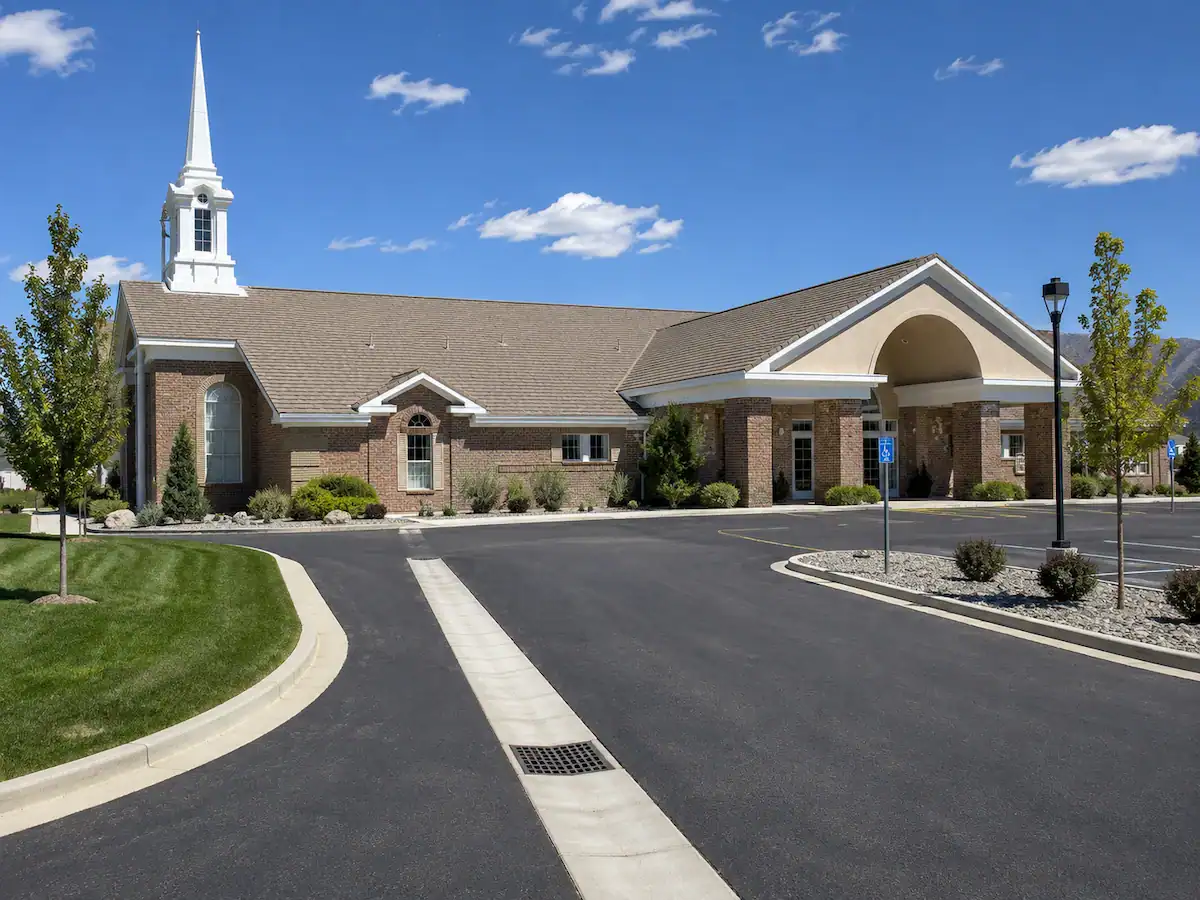 Utah church property featuring a parking lot drainage channel designed to manage stormwater runoff and protect asphalt pavement.