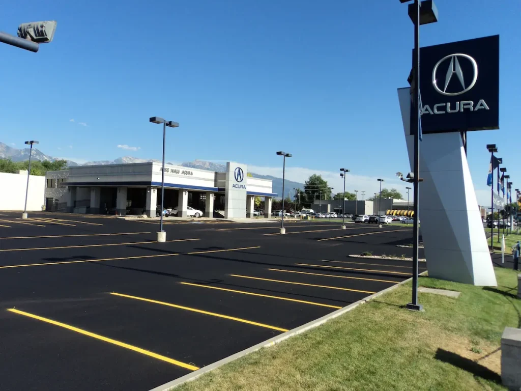 Professional commercial parking lot striping at a Utah Acura dealership