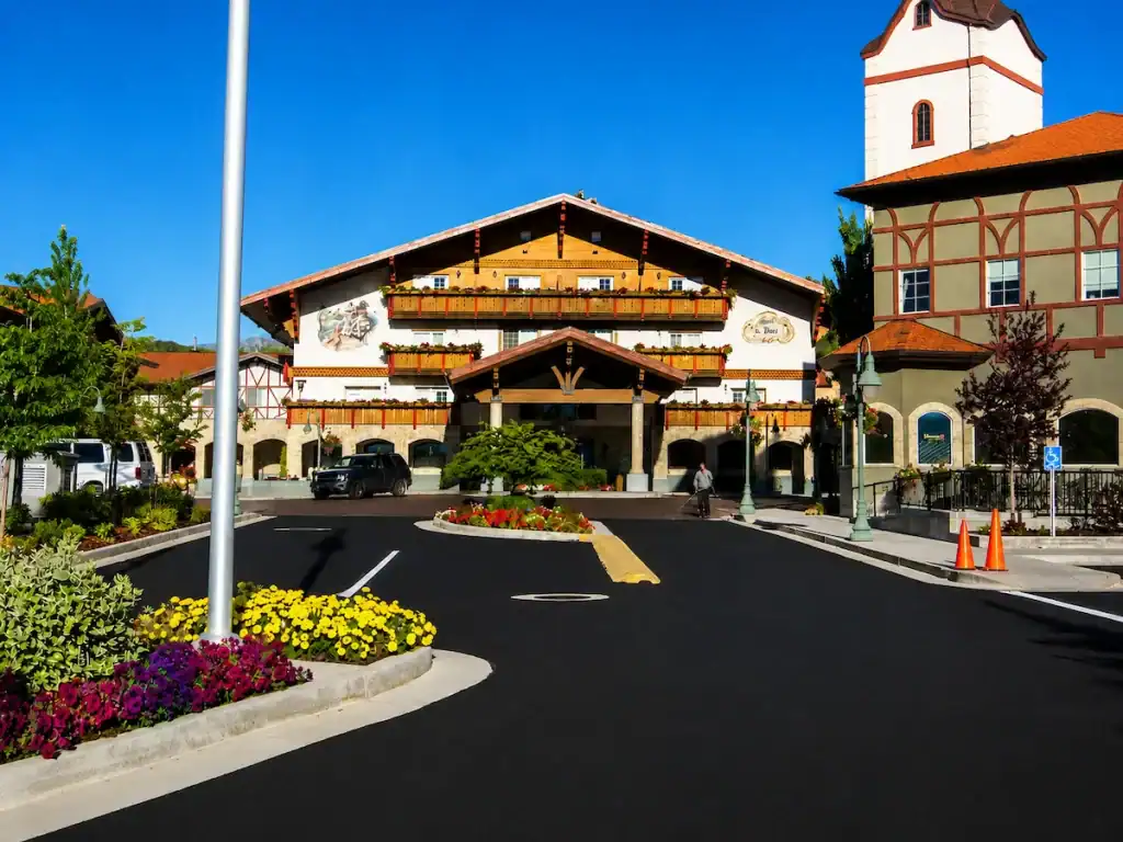Freshly sealcoated commercial parking lot at a Salt Lake City property with clean asphalt and professional pavement maintenance.