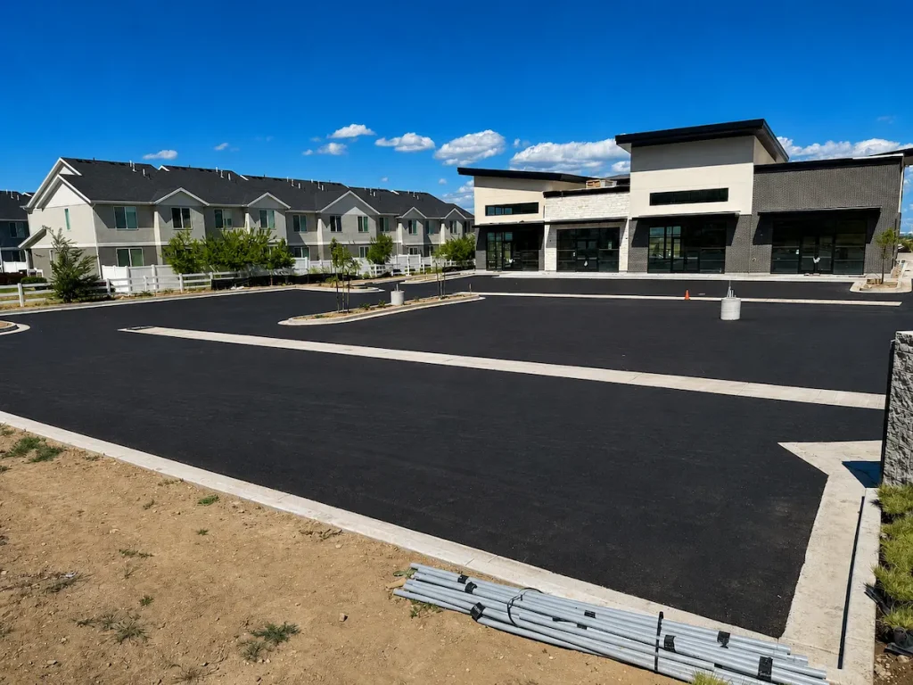 New commercial asphalt parking lot installation completed at a retail development in Utah.