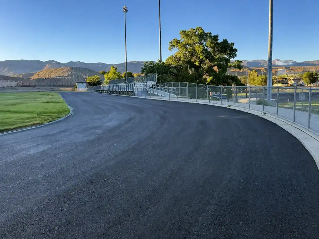 Newly paved asphalt track at Carbon High School in Price, Utah, after a full asphalt replacement.