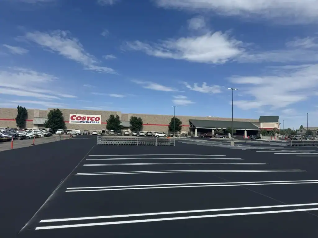 Freshly sealcoated and striped Costco parking lot in Orem, Utah, viewed from the side of the property.