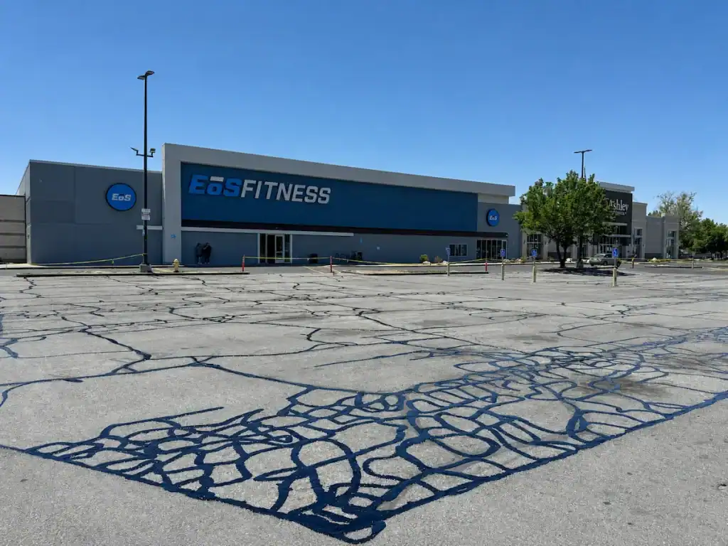 Completed crack sealing throughout the EOS Fitness parking lot in Orem, Utah.