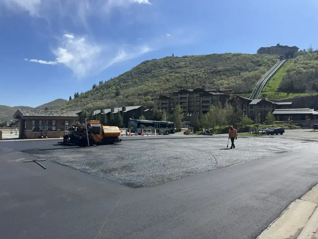 Eckles Paving crew installing a fresh asphalt overlay at Deer Valley Resort in Park City, Utah.
