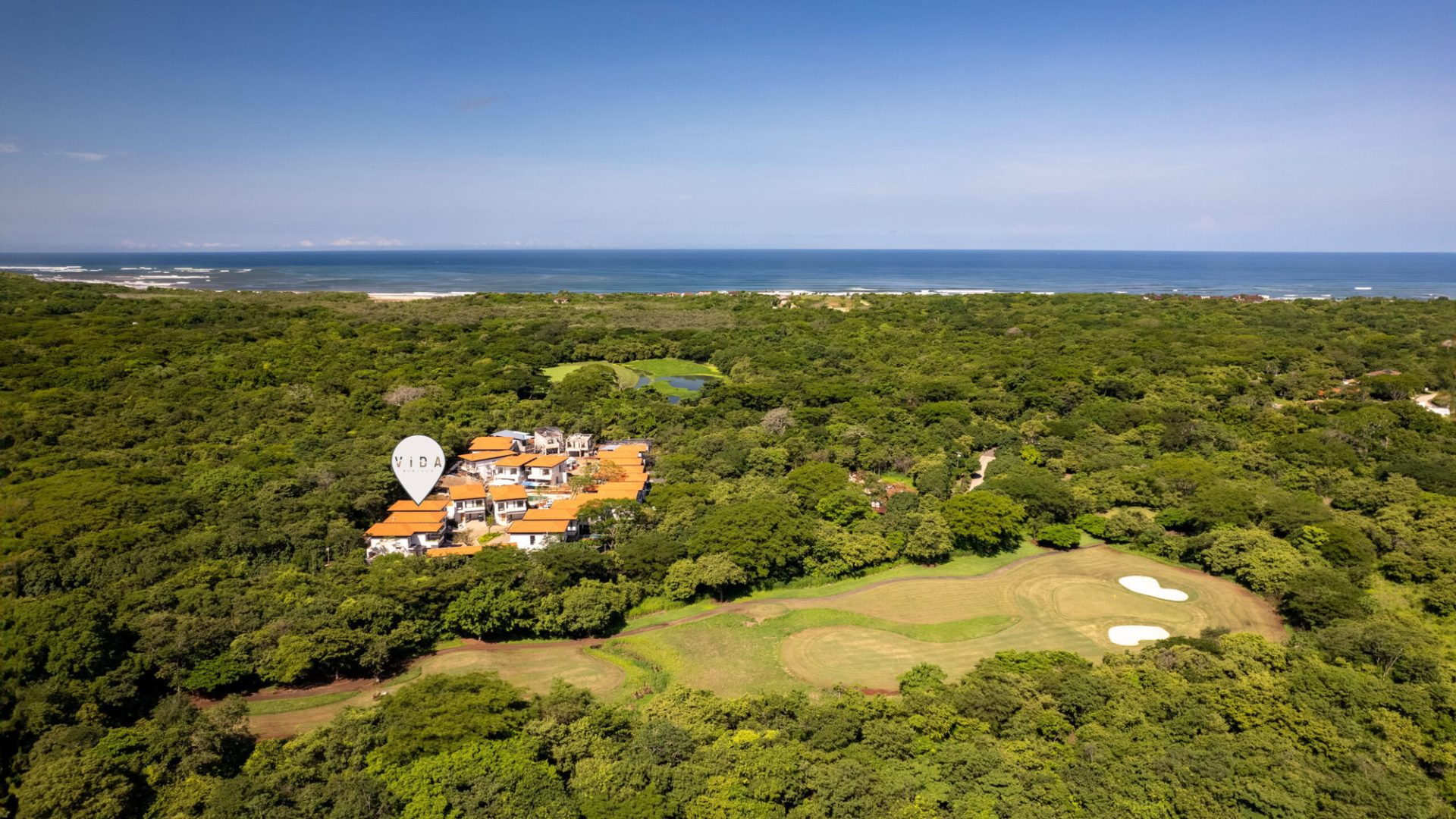 Luxury beachfront villas in a lush golf course, ocean view, Vida Pinilla Costa Rica coastal property.