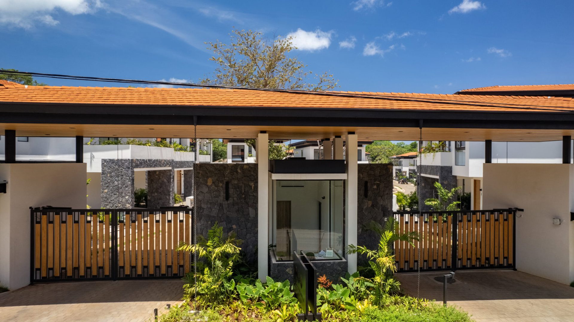 Modern residential homes with lush landscaping and contemporary design.