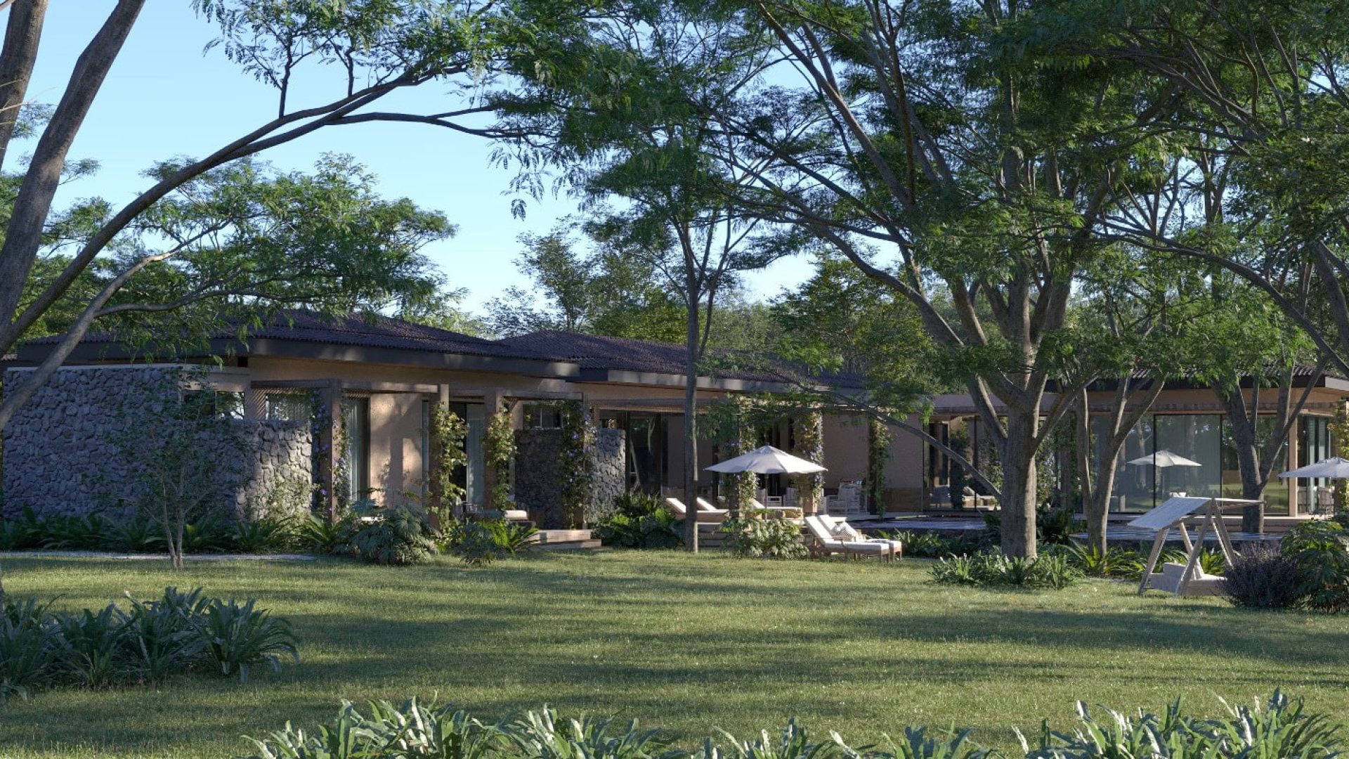 Modern luxury villa surrounded by lush greenery and outdoor lounge areas.