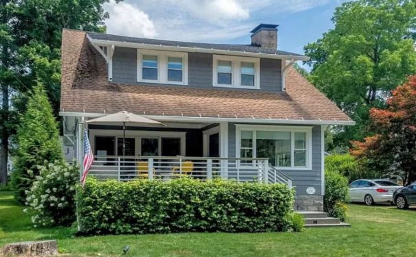 A welcoming Bemus Point NY home shows pride and comfort, with a porch and neat yard that suggest family and community.