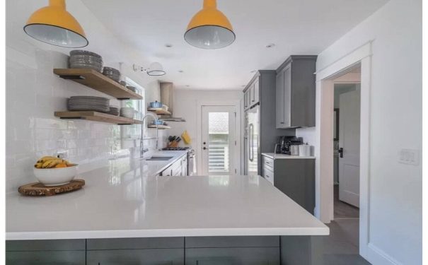 The Bemus Point NY kitchen feels cheerful and welcoming, filled with natural light and a cozy, modern style.