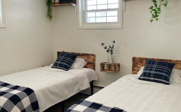 A welcoming Bemus Point NY bedroom shows comfort and a tidy space made for relaxing and sharing with a friend.