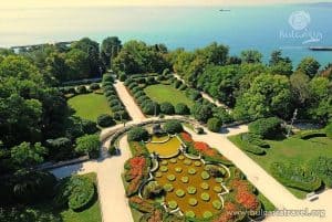 Aerial view of garden with fountain and trees.