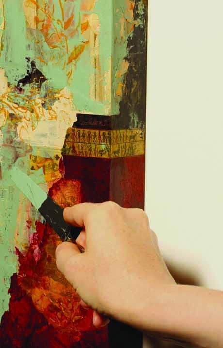 Colorful artist painting on canvas with palette knife, showcasing vibrant abstract artwork at Visual Arts Passage.