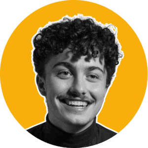 Vibrant portrait of a young man with curly hair, smiling, in black and white photo with bold yellow and green circular background, emphasizing artistic and modern photography styles.