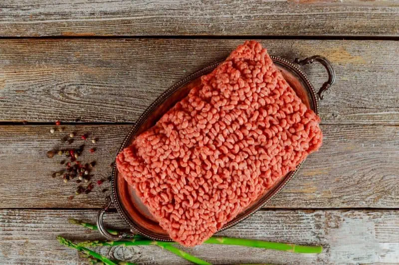 Classic Beef And Potato Casserole: A Comforting And Hearty Recipe 8 Flat lay fresh ingredients for cooking ground minced beef meat, black pepper and asparagus classic beef and potato casserole